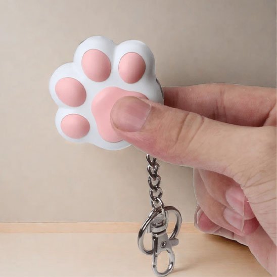 Laser pour chat en forme de patte blanc et rose