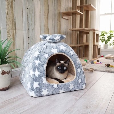 Maison pour chat étoilée et siamois couché dedans 