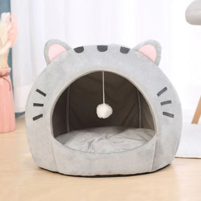 Niche pour chat avec un pompon blanc