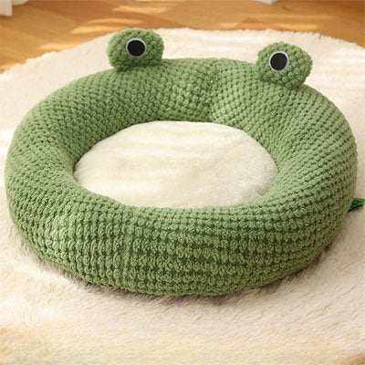 Niche pour chat donut avec des yeux de grenouille