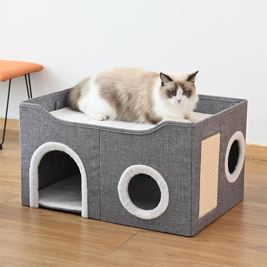 Niche pour chat elle est de couleur gris et blanc 